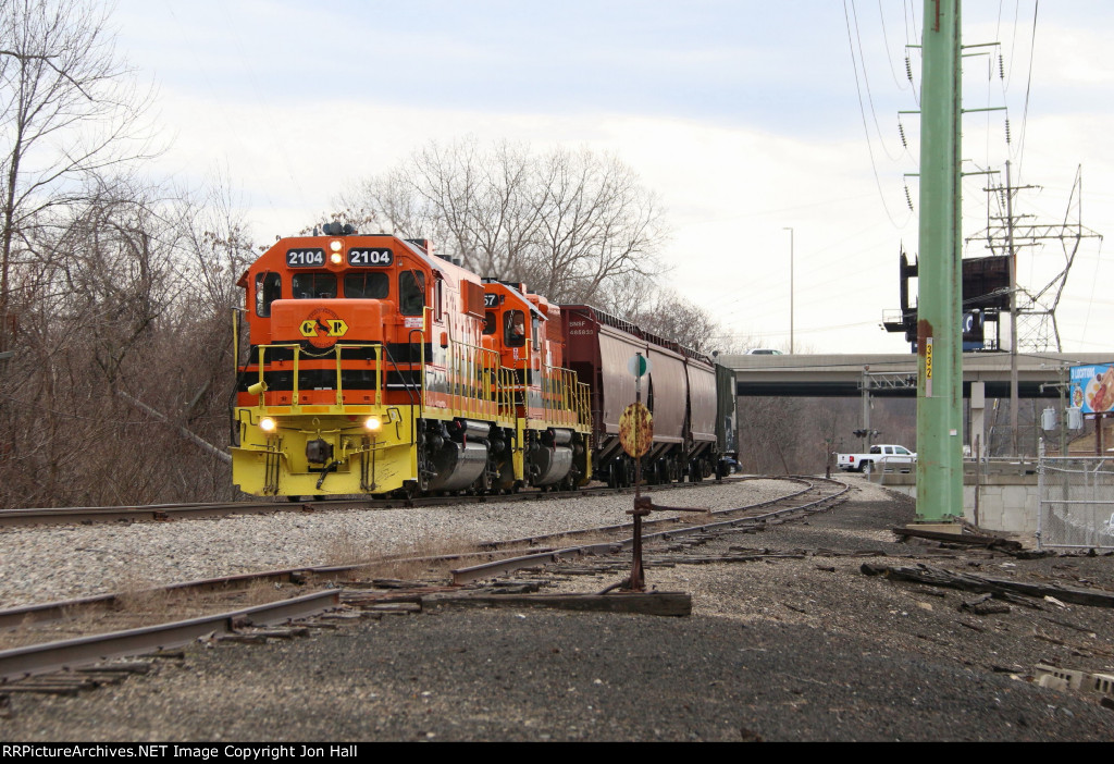 2104 comes west leading the 2057 and 4 covered hoppers